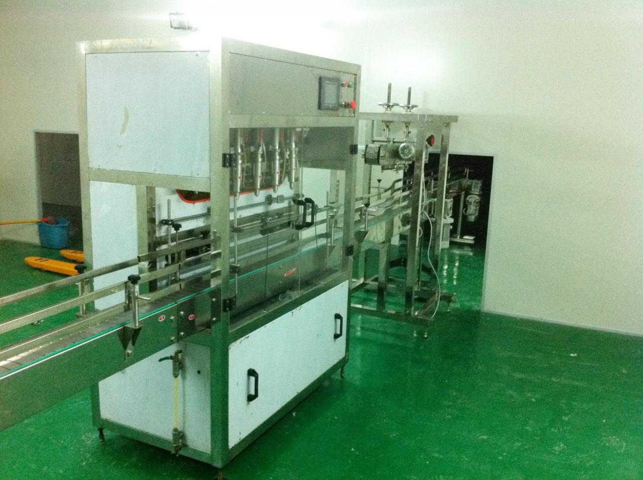 Linear filling machine with 4 filling heads લીનિયર ફિલિંગ મશીન.jpg