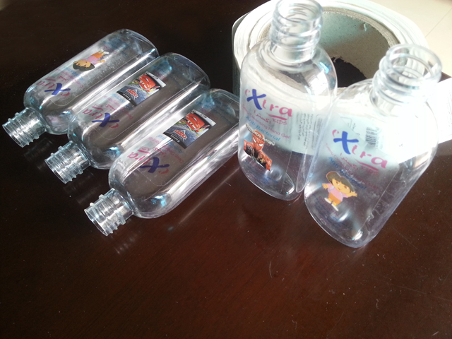 transparent labels labelled samples bottles plane surface Mrwan નમૂના પારદર્શક લેબલ્સ અને બોટલ (3).jpg