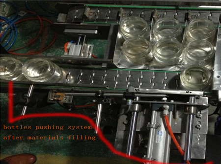 automatic bottles pushing system after filing બોટલ દબાણ સિસ્ટમ.jpg